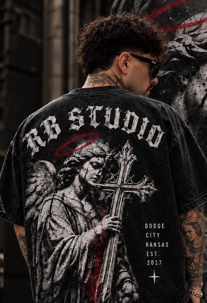Back of the RB Studio Angel Tee showing arched gothic "RB STUDIO", stone angel with red halo and ornate cross