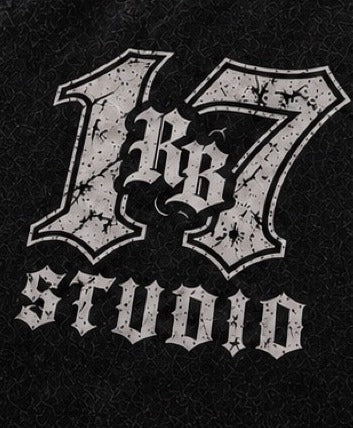 Close-up of the distressed "17" RB monogram and STUDIO chest print