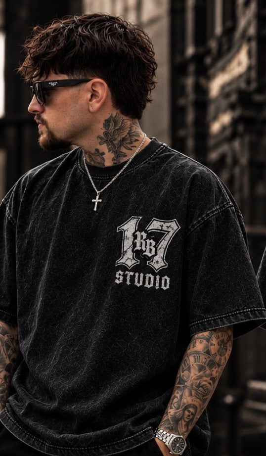 Model wearing the RB Studio Angel Tee in acid-washed black, front with "17" RB Studio chest logo