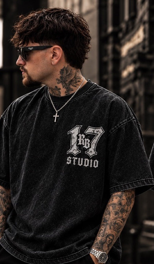 Model wearing the RB Studio Angel Tee in acid-washed black, front with "17" RB Studio chest logo